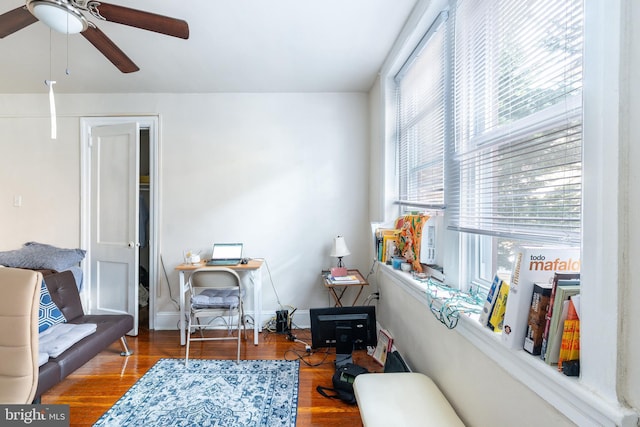 sitting room featuring ceiling fan and hardwood / wood-style floors