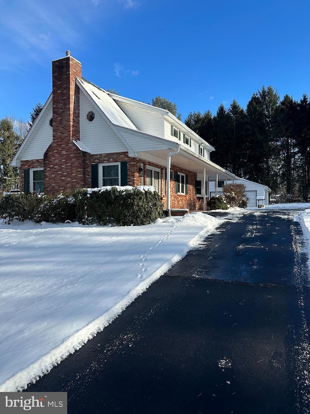 view of front of house with an outbuilding and a garage