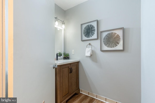 bathroom featuring hardwood / wood-style flooring and vanity