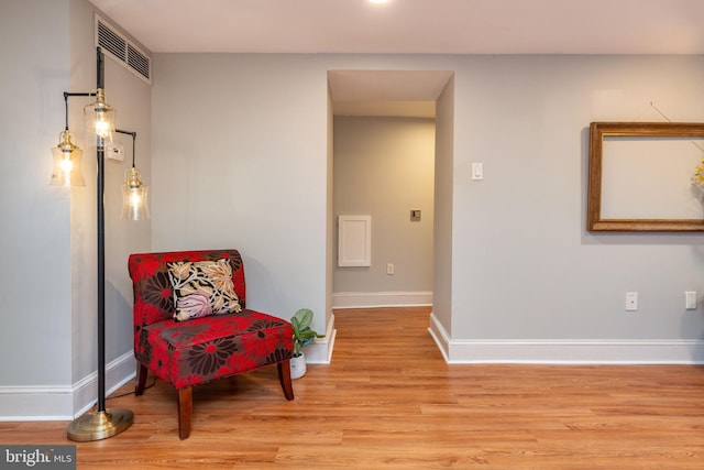 sitting room featuring light hardwood / wood-style floors