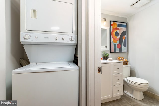 laundry room with stacked washer and clothes dryer