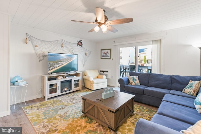 living room featuring a wall mounted air conditioner, hardwood / wood-style flooring, wooden ceiling, and ceiling fan