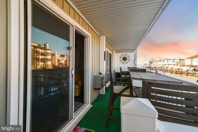 view of balcony at dusk