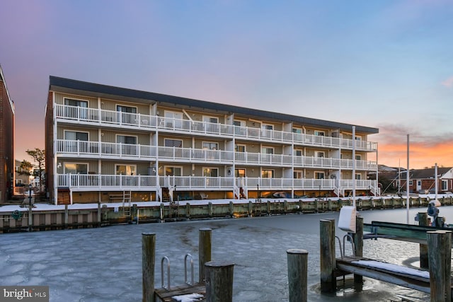 outdoor building at dusk featuring a water view