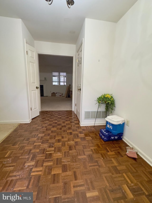 hall featuring dark parquet floors