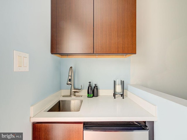 kitchen featuring dishwasher and sink