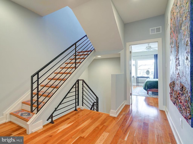 stairway featuring hardwood / wood-style floors