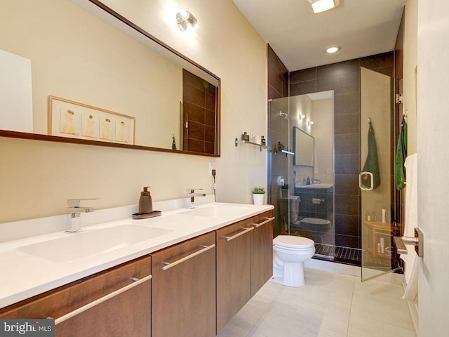 bathroom with toilet, vanity, an enclosed shower, and tile patterned flooring