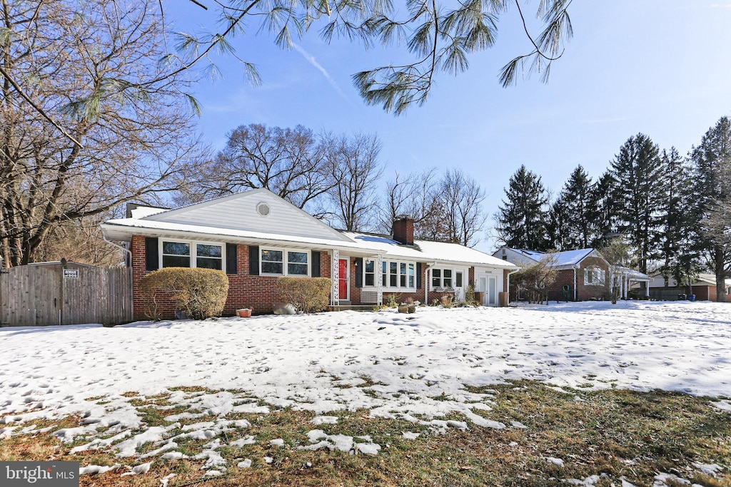 view of snow covered house