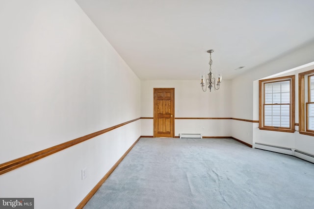 unfurnished room with a baseboard radiator, light colored carpet, and a notable chandelier