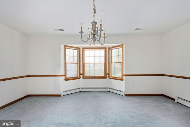 carpeted spare room featuring a baseboard heating unit and a chandelier