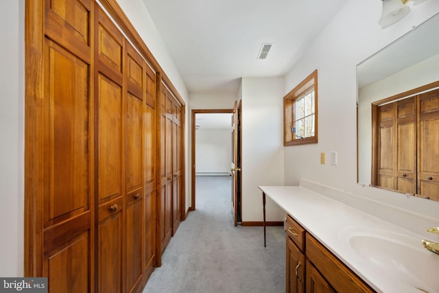 bathroom featuring vanity and a baseboard radiator