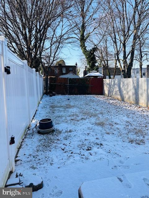 view of yard covered in snow