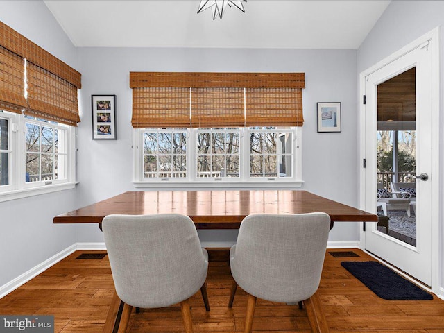 dining area with dark hardwood / wood-style flooring and breakfast area