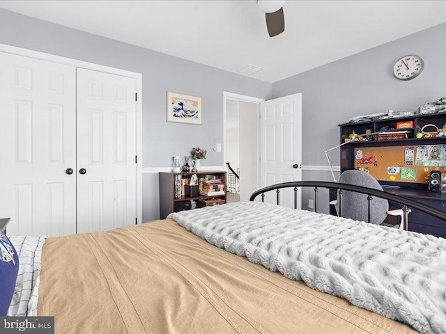 bedroom with ceiling fan and a closet