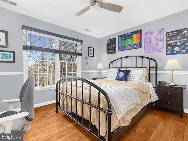 bedroom with ceiling fan and light wood-type flooring