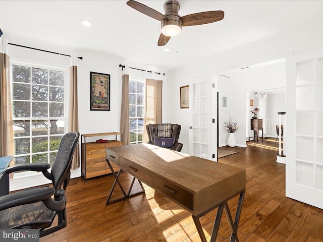 office with dark wood-type flooring and ceiling fan