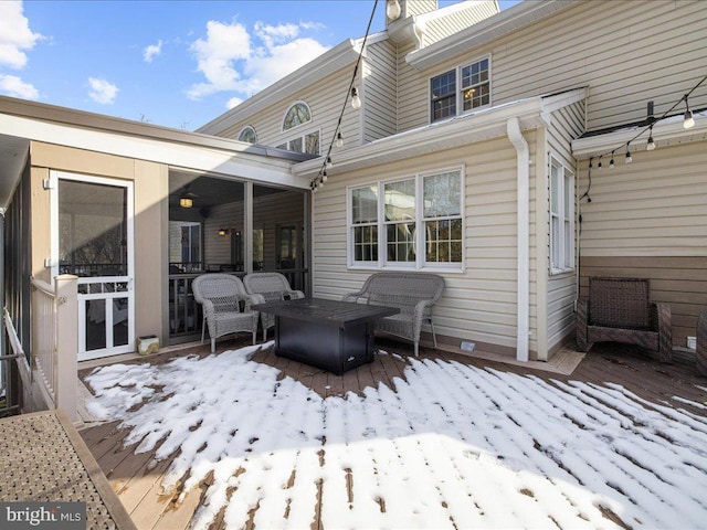 view of snow covered deck