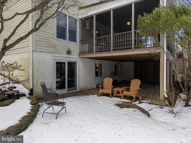 view of snow covered house