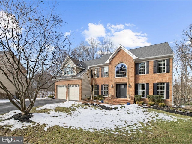 colonial inspired home with a garage