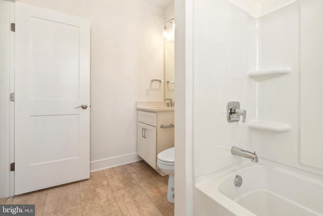 full bathroom with vanity, washtub / shower combination, and toilet