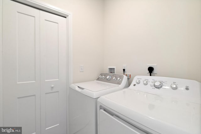 clothes washing area with washer and dryer