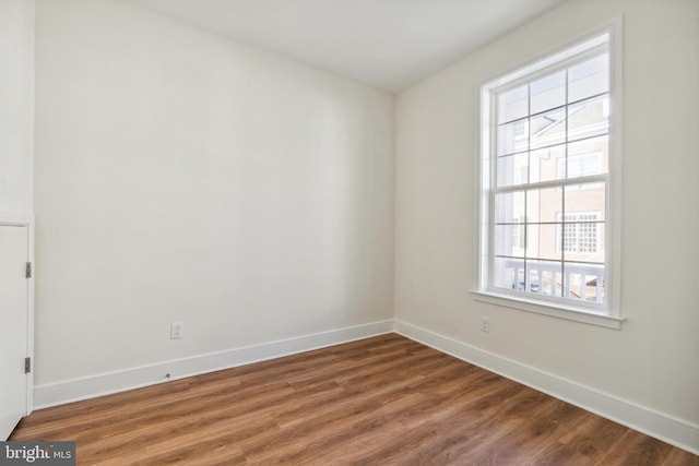 empty room with wood-type flooring