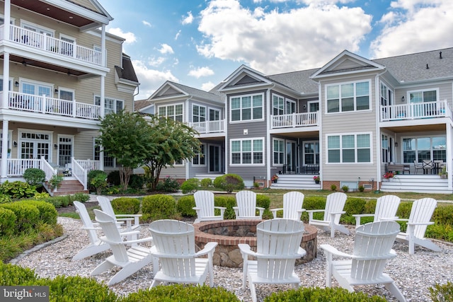 back of property featuring a fire pit