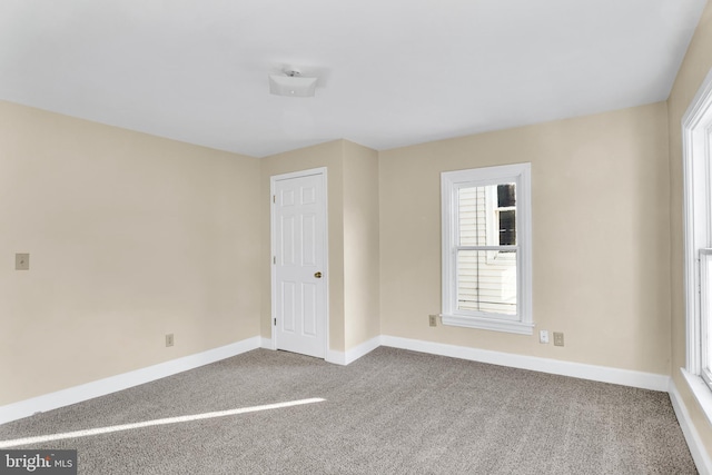 empty room featuring carpet flooring