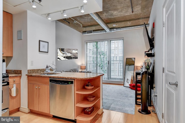 kitchen featuring stone counters, rail lighting, stainless steel dishwasher, kitchen peninsula, and light hardwood / wood-style flooring