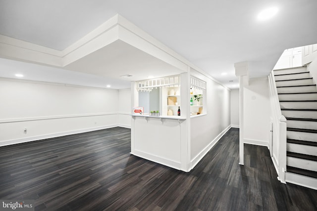 interior space with white cabinetry, dark hardwood / wood-style floors, and crown molding