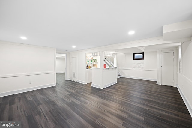 interior space with built in features and dark hardwood / wood-style floors