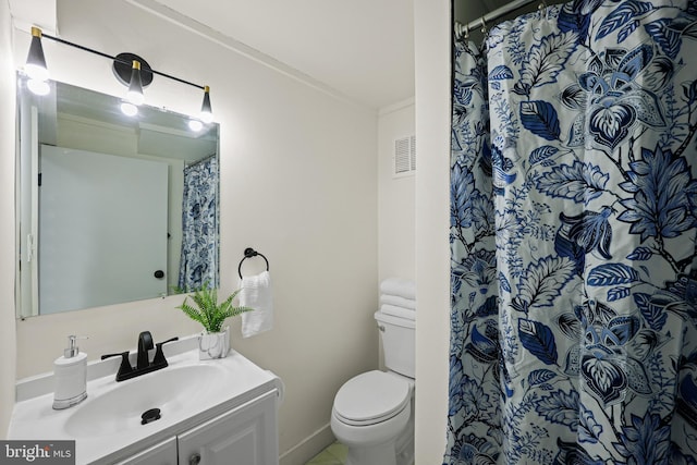 bathroom with vanity, toilet, and a shower with shower curtain