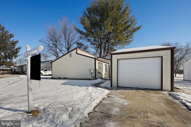 view of snow covered garage