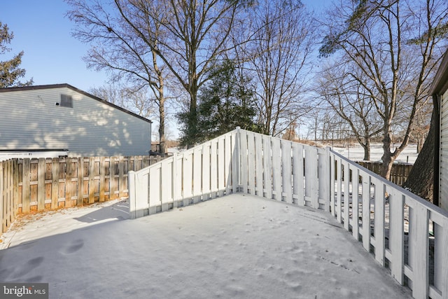 view of yard layered in snow