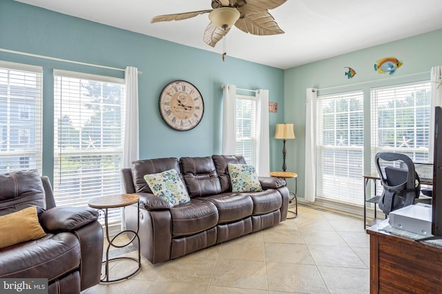 tiled living room with ceiling fan