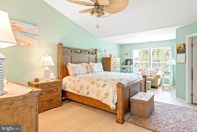 bedroom featuring vaulted ceiling, ceiling fan, and light hardwood / wood-style flooring