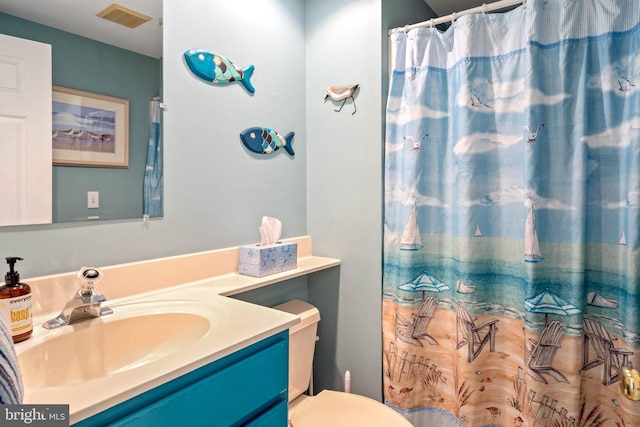 bathroom with vanity and toilet