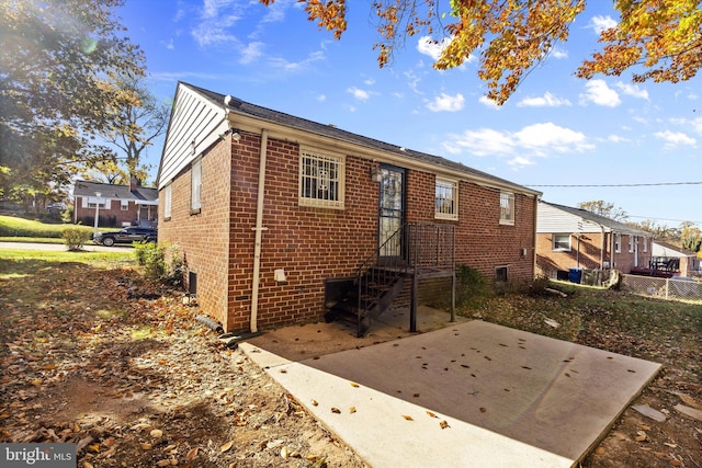 back of property with a patio area