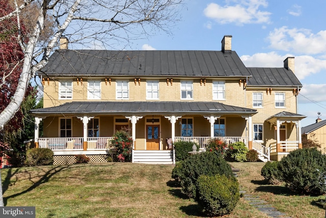 view of front of home with a front lawn and a porch