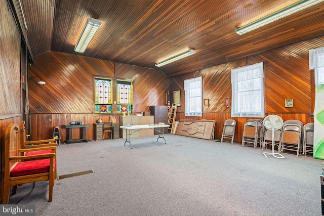 carpeted office with vaulted ceiling and wooden ceiling