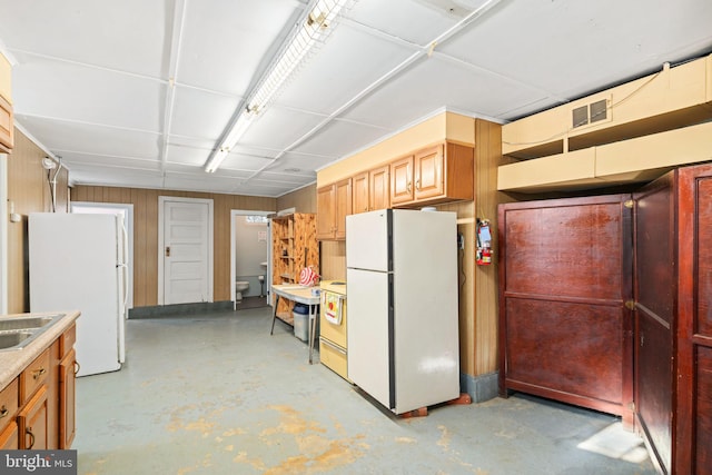 kitchen with sink and white refrigerator