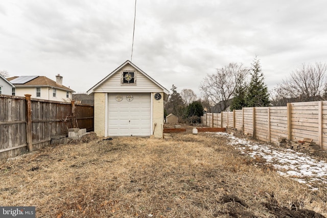 view of yard featuring an outbuilding and a garage