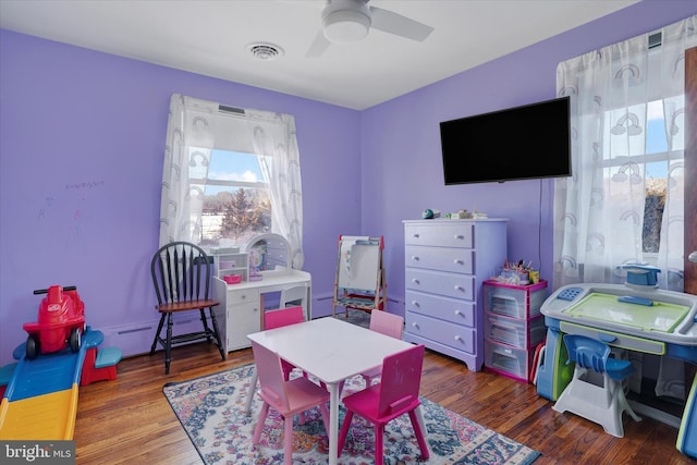 rec room featuring dark wood-type flooring and ceiling fan