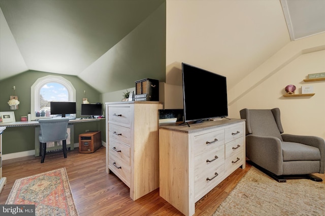 office area featuring hardwood / wood-style flooring and lofted ceiling