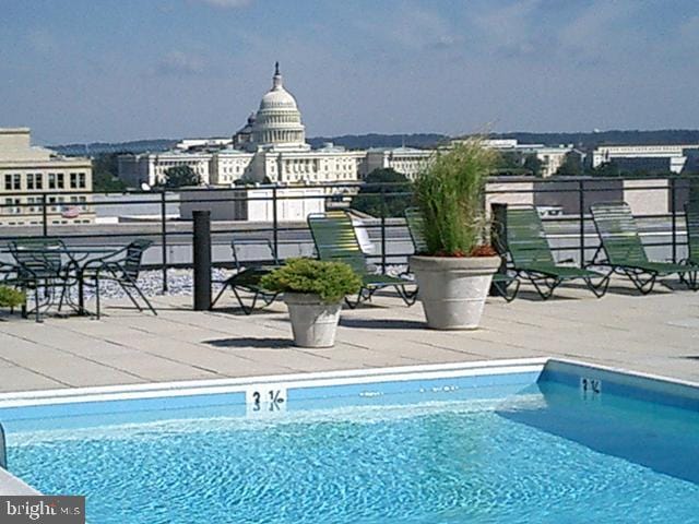 view of swimming pool featuring a patio area