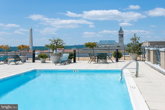 view of swimming pool with a patio