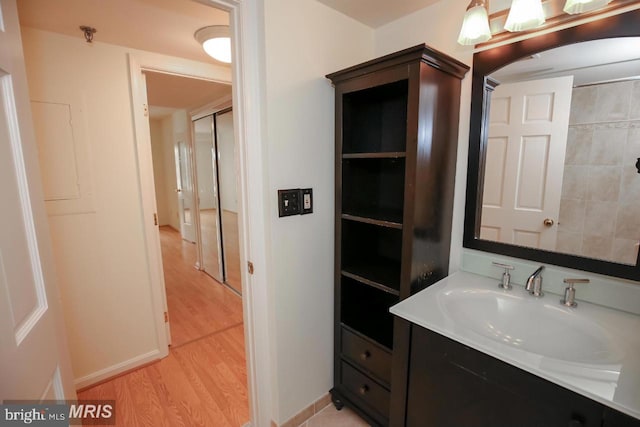 bathroom with vanity and hardwood / wood-style flooring