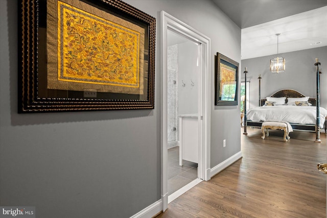 bedroom with hardwood / wood-style flooring