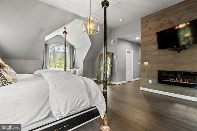 bedroom with dark wood-type flooring, lofted ceiling, and wooden walls